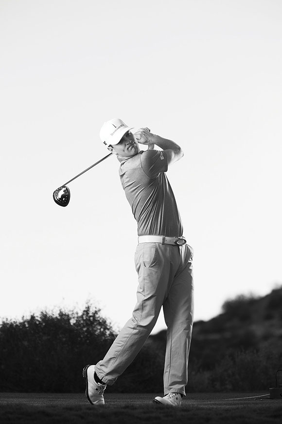 Image of zach johnson swinging a golf club