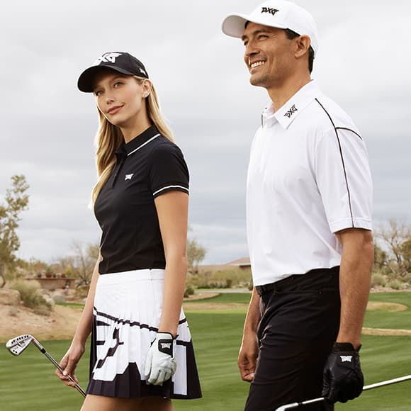 Woman and Man on Golf Course in PXG Apparel holding PXG Irons