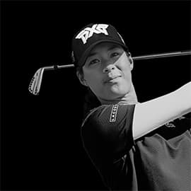Headshot of Celine Boutier swinging a golf club on a black background