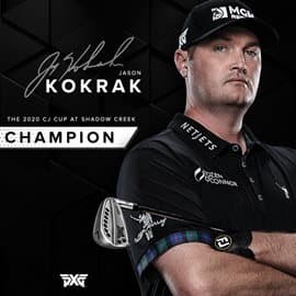Jason Kokrack posing with a golf club on a black background