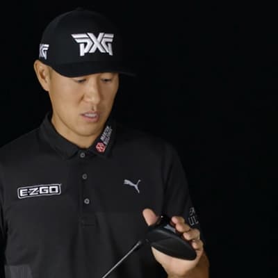 James Hahn holding golf club