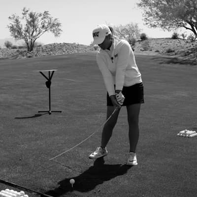 Sarah Stone swinging golf club