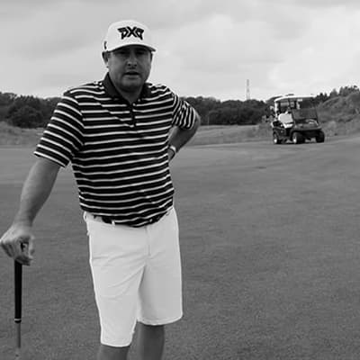 Jason Enloe standing on golf course